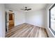 Bright bedroom with hardwood floors and a ceiling fan at 6228 E Blanche Dr, Scottsdale, AZ 85254