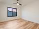 Bedroom with hardwood floors and a large window offering natural light at 6228 E Blanche Dr, Scottsdale, AZ 85254
