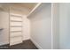 Walk-in closet with built-in shelving for ample storage space at 6228 E Blanche Dr, Scottsdale, AZ 85254