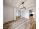 Open dining room with modern light fixture and hardwood floors at 6228 E Blanche Dr, Scottsdale, AZ 85254