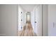 Hallway featuring new hardwood floors, new doors, and modern hardware at 6228 E Blanche Dr, Scottsdale, AZ 85254