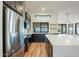 Modern kitchen with stainless steel appliances, dark cabinets, white countertops, and an island with bar seating at 6228 E Blanche Dr, Scottsdale, AZ 85254