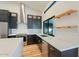 Bright kitchen features black cabinets, stainless appliances, white countertops, and an eat-in island with a view at 6228 E Blanche Dr, Scottsdale, AZ 85254