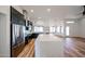 Open concept kitchen with a large island, black cabinets and stainless steel appliances at 6228 E Blanche Dr, Scottsdale, AZ 85254