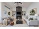 Spacious living room with built-in shelving, fireplace, and stylish decor at 6228 E Blanche Dr, Scottsdale, AZ 85254