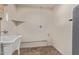 Unfinished basement featuring a utility sink, water heater, and concrete floors at 6733 N 49Th Ave, Glendale, AZ 85301