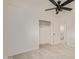Bedroom featuring a ceiling fan, closet, and doorway to an adjacent room at 6733 N 49Th Ave, Glendale, AZ 85301