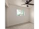 Bedroom with a ceiling fan and a large window at 6733 N 49Th Ave, Glendale, AZ 85301