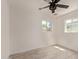 A bright bedroom with two windows and a ceiling fan at 6733 N 49Th Ave, Glendale, AZ 85301