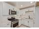 Kitchen showcasing stainless steel appliances, granite countertops, and white cabinetry at 6733 N 49Th Ave, Glendale, AZ 85301