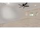 Bright living room featuring tile floors, a ceiling fan and white walls at 6733 N 49Th Ave, Glendale, AZ 85301