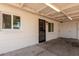 Covered patio providing a shaded outdoor area with secure entry gate at 6733 N 49Th Ave, Glendale, AZ 85301