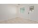 Bright room featuring tile floors, a window, and a white door leading to the outside at 6733 N 49Th Ave, Glendale, AZ 85301