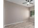 Neutral bedroom with window and modern floors showcases natural light and relaxing space at 7214 W Columbine Dr, Peoria, AZ 85381