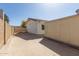 The exterior features a low block wall and concrete slab at 7214 W Columbine Dr, Peoria, AZ 85381