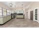 Spacious kitchen with stainless appliances, dark countertops, and modern pendant lighting at 7214 W Columbine Dr, Peoria, AZ 85381