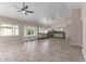 Open floor plan with spacious kitchen with modern appliances and adjacent living area at 7214 W Columbine Dr, Peoria, AZ 85381