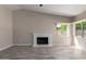 Bright living room featuring fireplace, neutral paint, wood floors, and natural light at 7214 W Columbine Dr, Peoria, AZ 85381