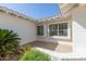 Cozy, covered porch with large windows offering plenty of natural light and views of the surrounding landscape at 7214 W Columbine Dr, Peoria, AZ 85381