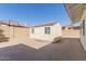 Backyard features a large storage shed with double doors, window, and concrete base at 7214 W Columbine Dr, Peoria, AZ 85381