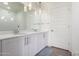 Modern bathroom featuring double sinks, white cabinetry, and stylish lighting at 7300 E Earll Dr # 1022, Scottsdale, AZ 85251