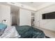 Large bedroom with an ensuite bath, a kitchen view, and a wall-mounted television at 7300 E Earll Dr # 1022, Scottsdale, AZ 85251