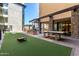 A spacious courtyard featuring outdoor games and recreational area at 7300 E Earll Dr # 1022, Scottsdale, AZ 85251