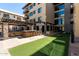 Outdoor courtyard with kitchen, bar, games and comfortable seating at 7300 E Earll Dr # 1022, Scottsdale, AZ 85251