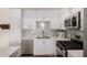 Clean kitchen featuring stainless steel appliances, white cabinets, and modern fixtures at 7300 E Earll Dr # 1022, Scottsdale, AZ 85251