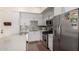 Contemporary kitchen showcasing stainless steel appliances, a white countertop, and ample cabinet space at 7300 E Earll Dr # 1022, Scottsdale, AZ 85251