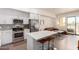 Open living space featuring a modern kitchen, living area, and balcony access, perfect for entertaining at 7300 E Earll Dr # 1022, Scottsdale, AZ 85251