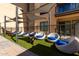 Inviting lounge area featuring comfortable seating, shaded by a modern canopy, and artificial grass at 7300 E Earll Dr # 1022, Scottsdale, AZ 85251