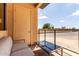 Outdoor patio space with a small table, seating, and a privacy wall at 7300 E Earll Dr # 1022, Scottsdale, AZ 85251