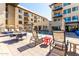 Outdoor pool area with seating and lounge chairs, perfect for relaxing and enjoying the amenities at 7300 E Earll Dr # 1022, Scottsdale, AZ 85251