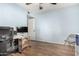 Bedroom includes hardwood floors, a ceiling fan and a workspace at 7515 W Sweetwater Ave, Peoria, AZ 85381