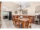 Traditional dining room with wood furniture and decorative accents. The room has neutral paint colors and tiled floors at 7515 W Sweetwater Ave, Peoria, AZ 85381