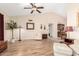 Bright living room with hardwood floors, vaulted ceilings, and comfortable seating at 7515 W Sweetwater Ave, Peoria, AZ 85381