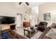 Spacious living room with tile flooring, comfortable seating, and a bright, airy feel at 7515 W Sweetwater Ave, Peoria, AZ 85381