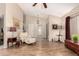 Well-lit living room featuring hardwood floors, stylish furnishings, and a welcoming atmosphere at 7515 W Sweetwater Ave, Peoria, AZ 85381