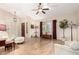 Open living room showcasing hardwood floors, large windows, and neutral tones at 7515 W Sweetwater Ave, Peoria, AZ 85381