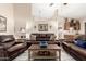 Cozy living room featuring comfortable seating, wet bar, and open layout at 7515 W Sweetwater Ave, Peoria, AZ 85381