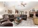 Comfortable living room features a brick fireplace, stylish bar area, and ample seating at 7515 W Sweetwater Ave, Peoria, AZ 85381