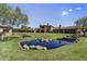 Expansive backyard featuring a serene pond and a stunning view of the residence at 7780 E Golden Eagle Cir, Gold Canyon, AZ 85118