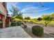 Expansive backyard featuring lush landscaping and a view of the golf course at 7780 E Golden Eagle Cir, Gold Canyon, AZ 85118