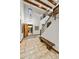 Grand foyer with a chandelier, staircase, tiled floors, and an open door at 7780 E Golden Eagle Cir, Gold Canyon, AZ 85118