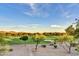 Scenic view of a meticulously maintained golf course surrounded by desert landscape and mountains at 7780 E Golden Eagle Cir, Gold Canyon, AZ 85118