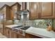 Elegant kitchen with quartz countertops, stainless steel appliances, and a decorative backsplash at 7780 E Golden Eagle Cir, Gold Canyon, AZ 85118