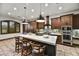 Gourmet kitchen with large island, modern appliances, and breakfast bar seating at 7780 E Golden Eagle Cir, Gold Canyon, AZ 85118