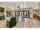 Spacious living room boasts a cozy fireplace, tile floors and easy outdoor access for indoor/outdoor entertaining at 7780 E Golden Eagle Cir, Gold Canyon, AZ 85118