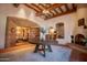 Elegant entryway featuring wood accents, stone fireplace and tiled flooring at the Superstition Mountain Golf and Country Club at 7780 E Golden Eagle Cir, Gold Canyon, AZ 85118